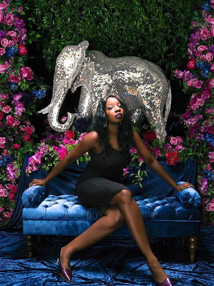 Erica Jones with a flower background