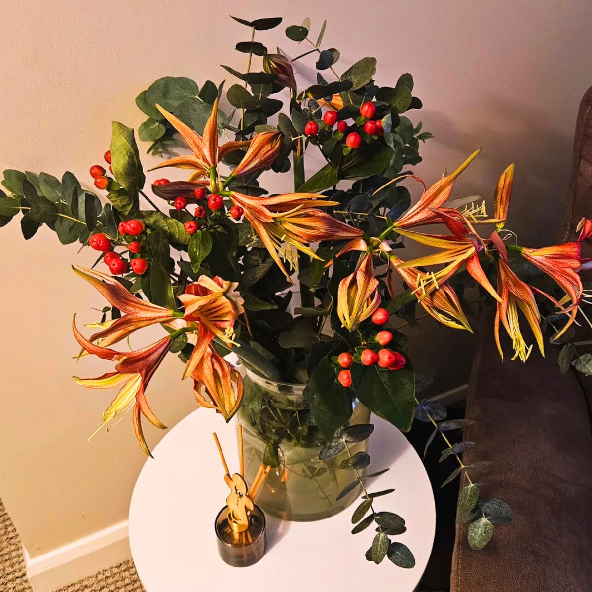 An arrangement with Hypericum and eucalyptus
