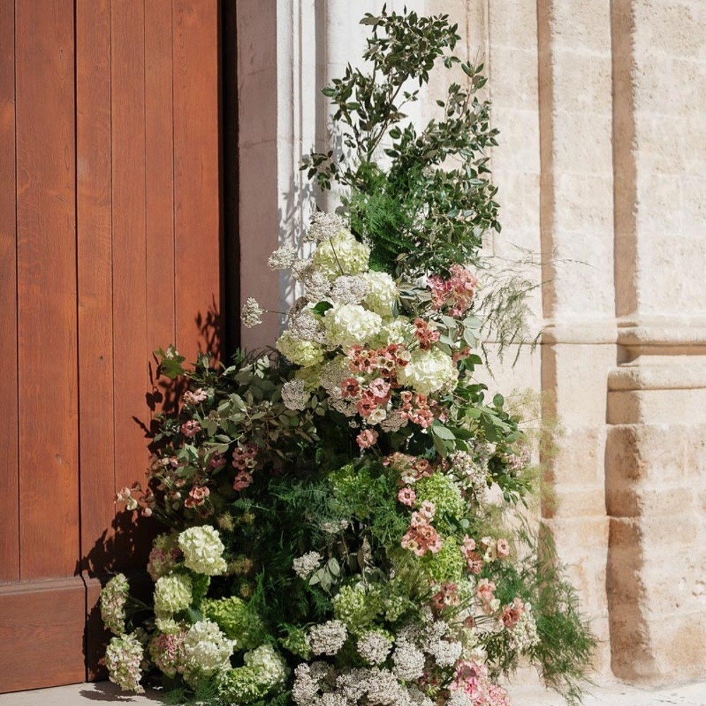 Lush floral arrangement on pedestal