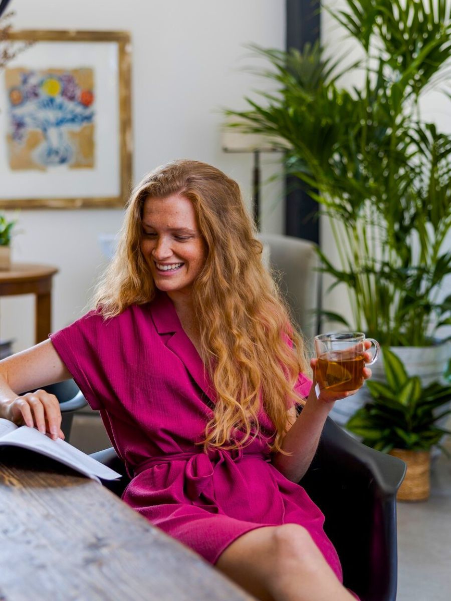 Air So Pure women with green plants in livingroom
