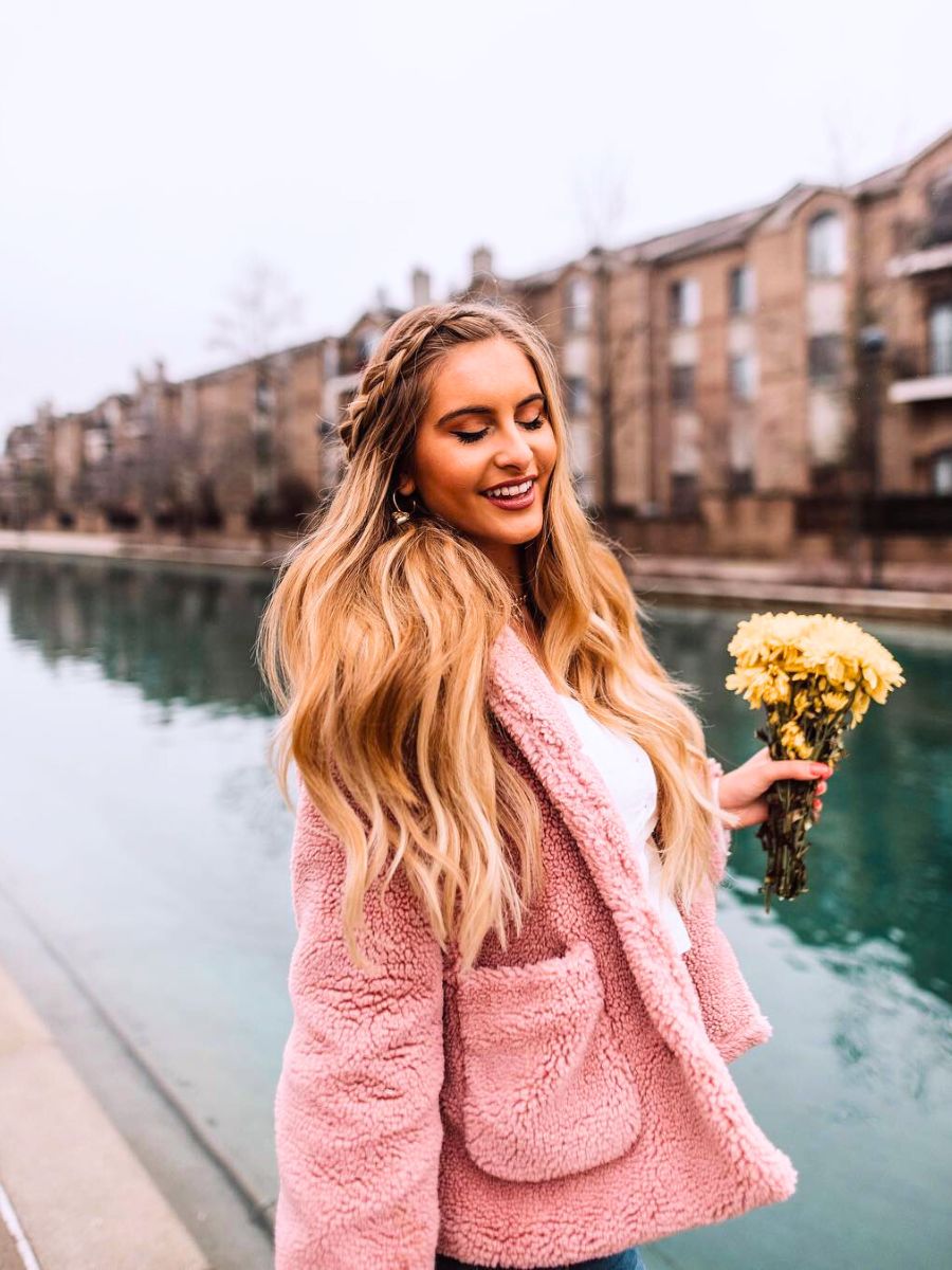 Girl holding a small yellow bouquet