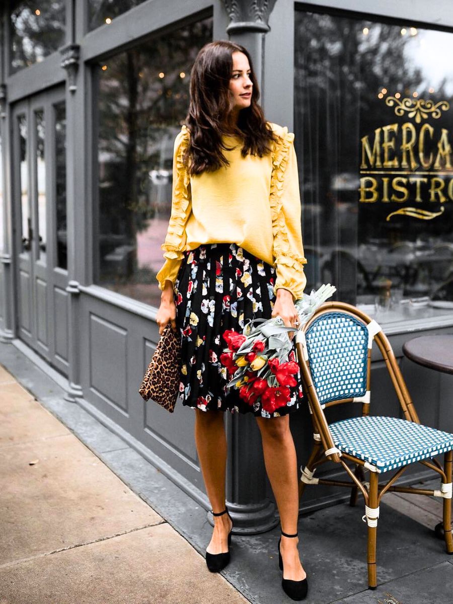 Holding flowers to beat the winter blues