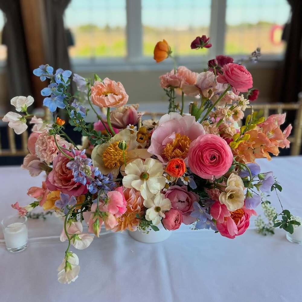 Vibrant floral wedding table centerpiece