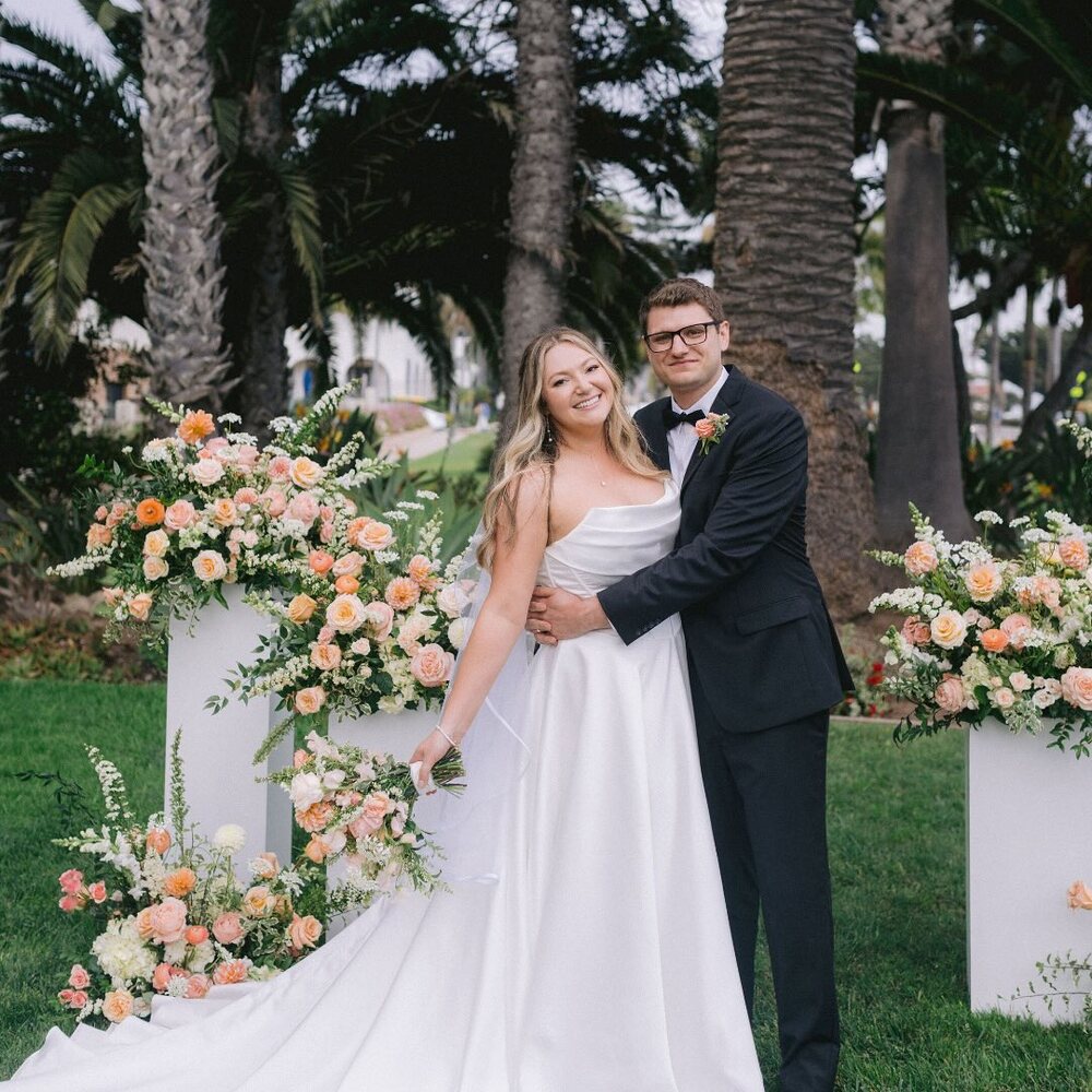 Couple posing at outdoor garden wedding