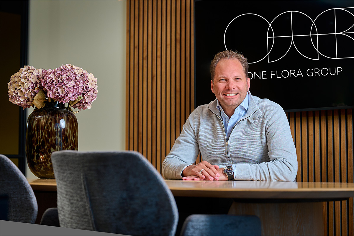 One Flora Group Sven Aertssen behind desk