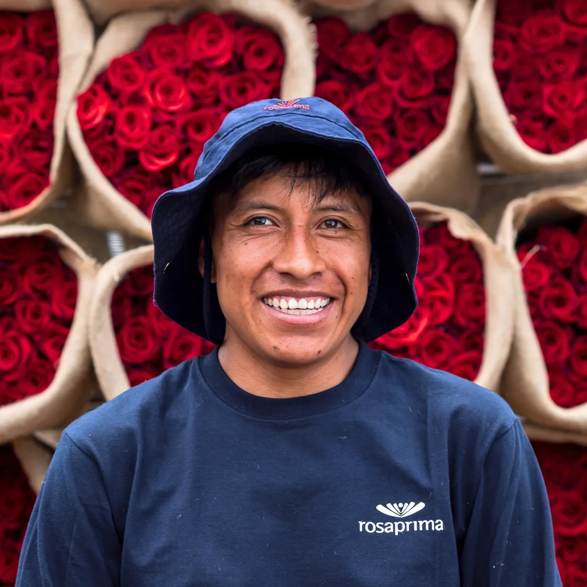 Rosaprima employee with red roses