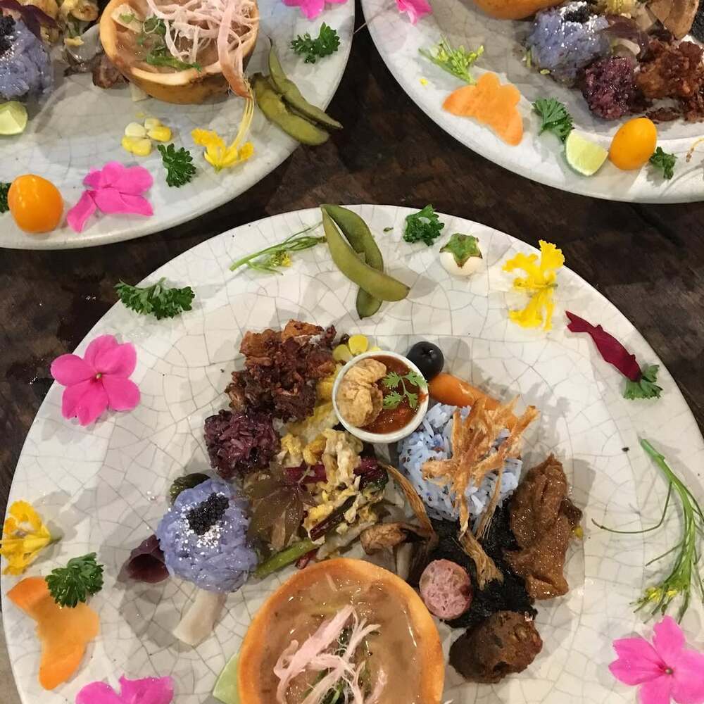 Plates of colorful floral-infused food