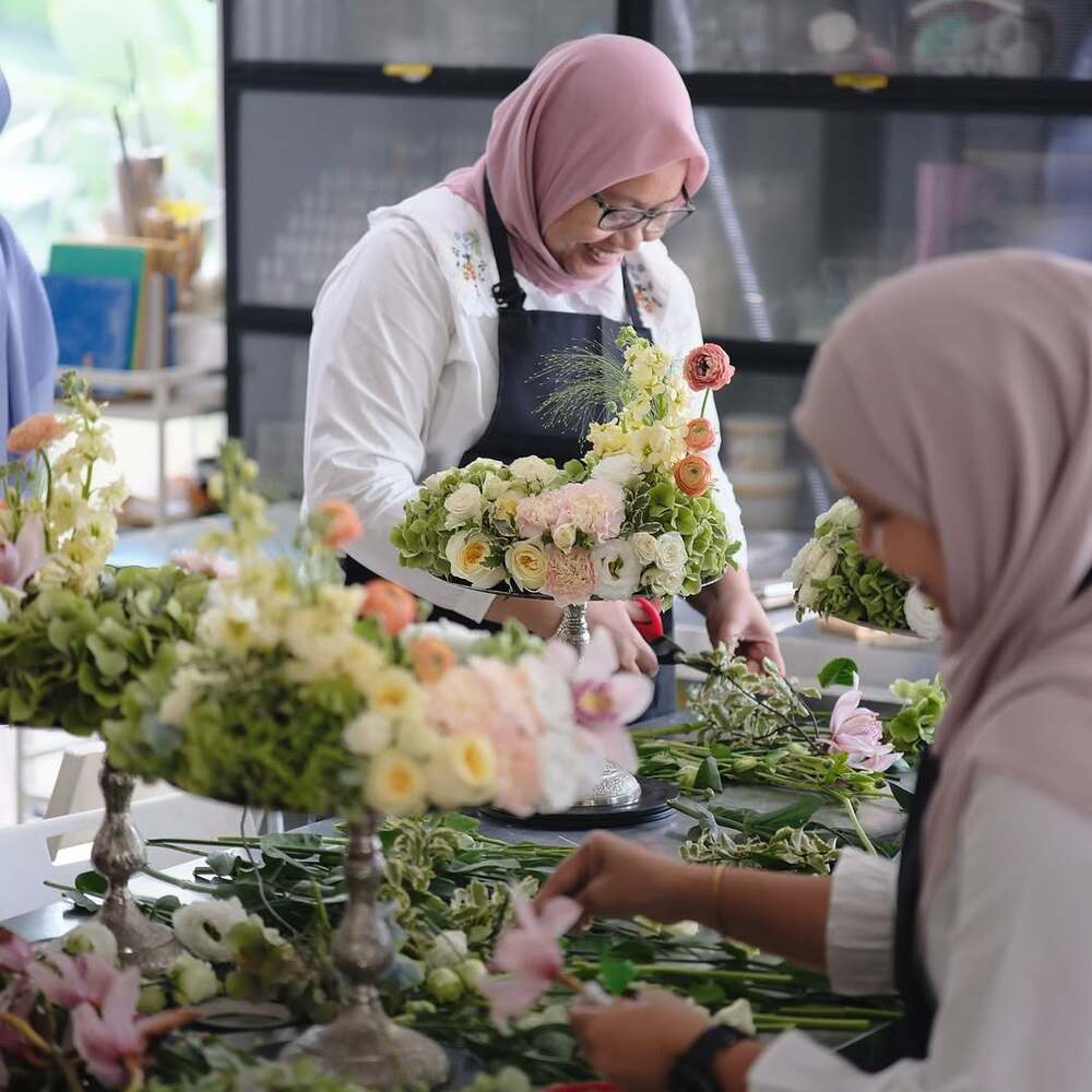 Florists using shears in workshop