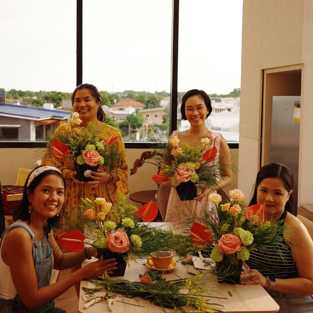 Florists with centerpieces and shears