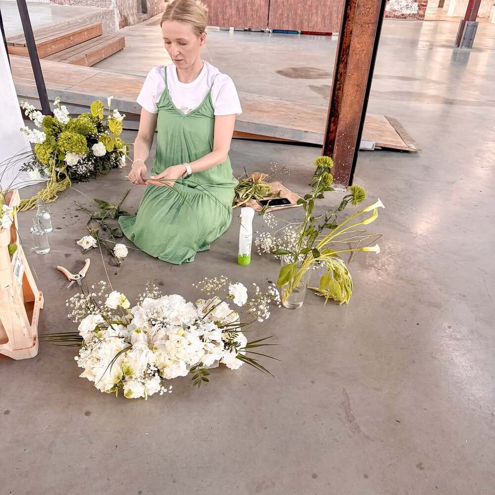 A florist prepares wedding arrangements