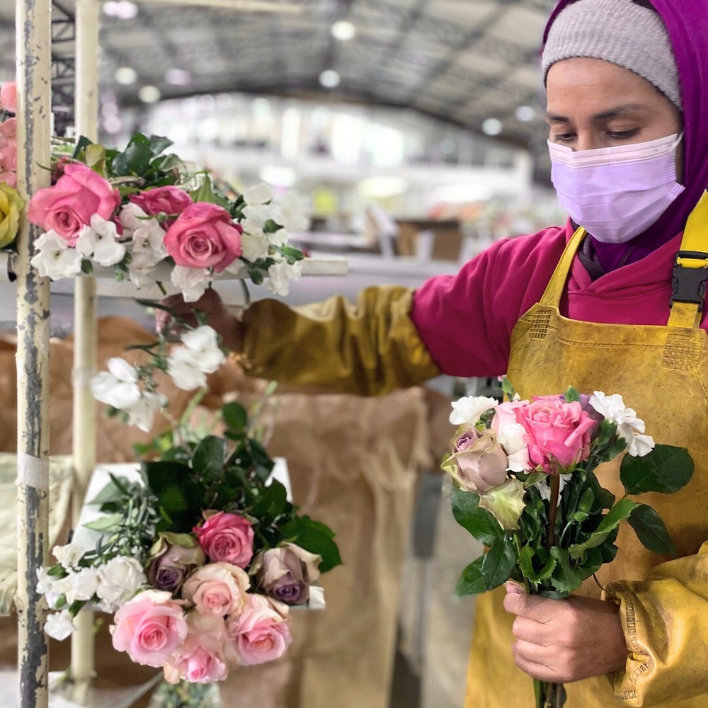 Carts of flowers at auction.