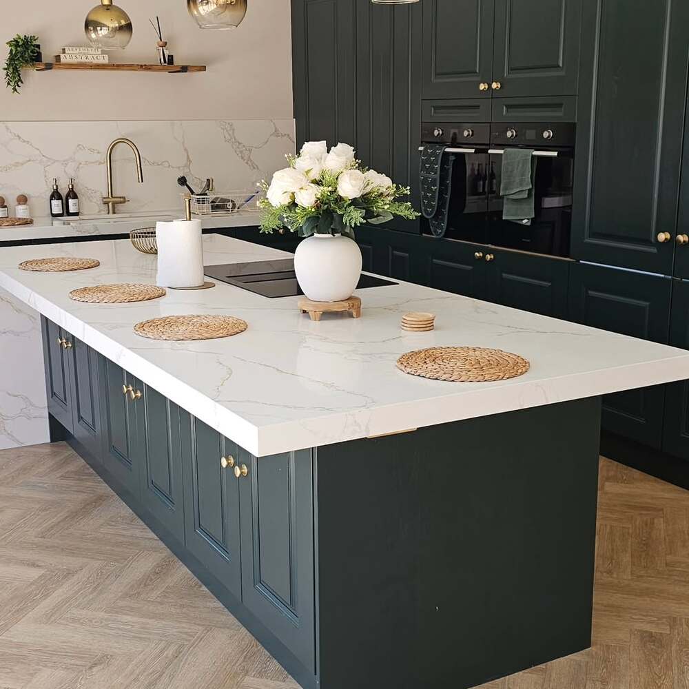 White flowers on dark green cabinets