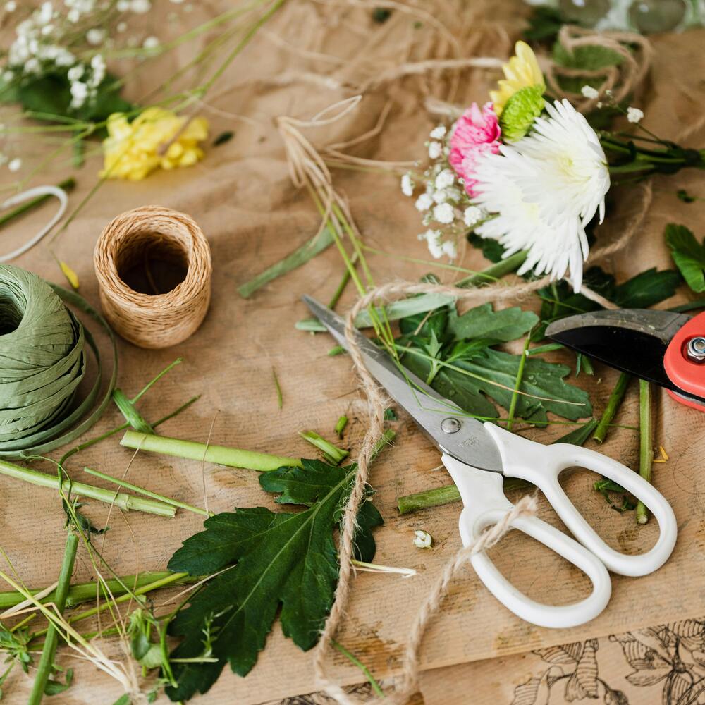Floristry tools and twine on workbench