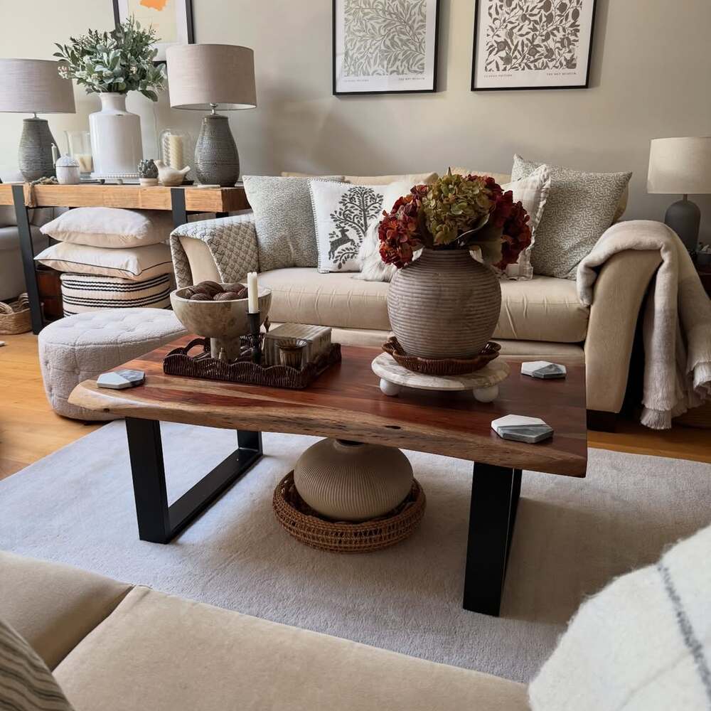 Neutral sofa with floral centerpieces