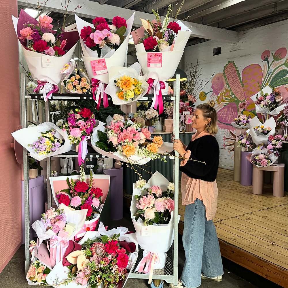 Girl with Flower trolley in flower shop