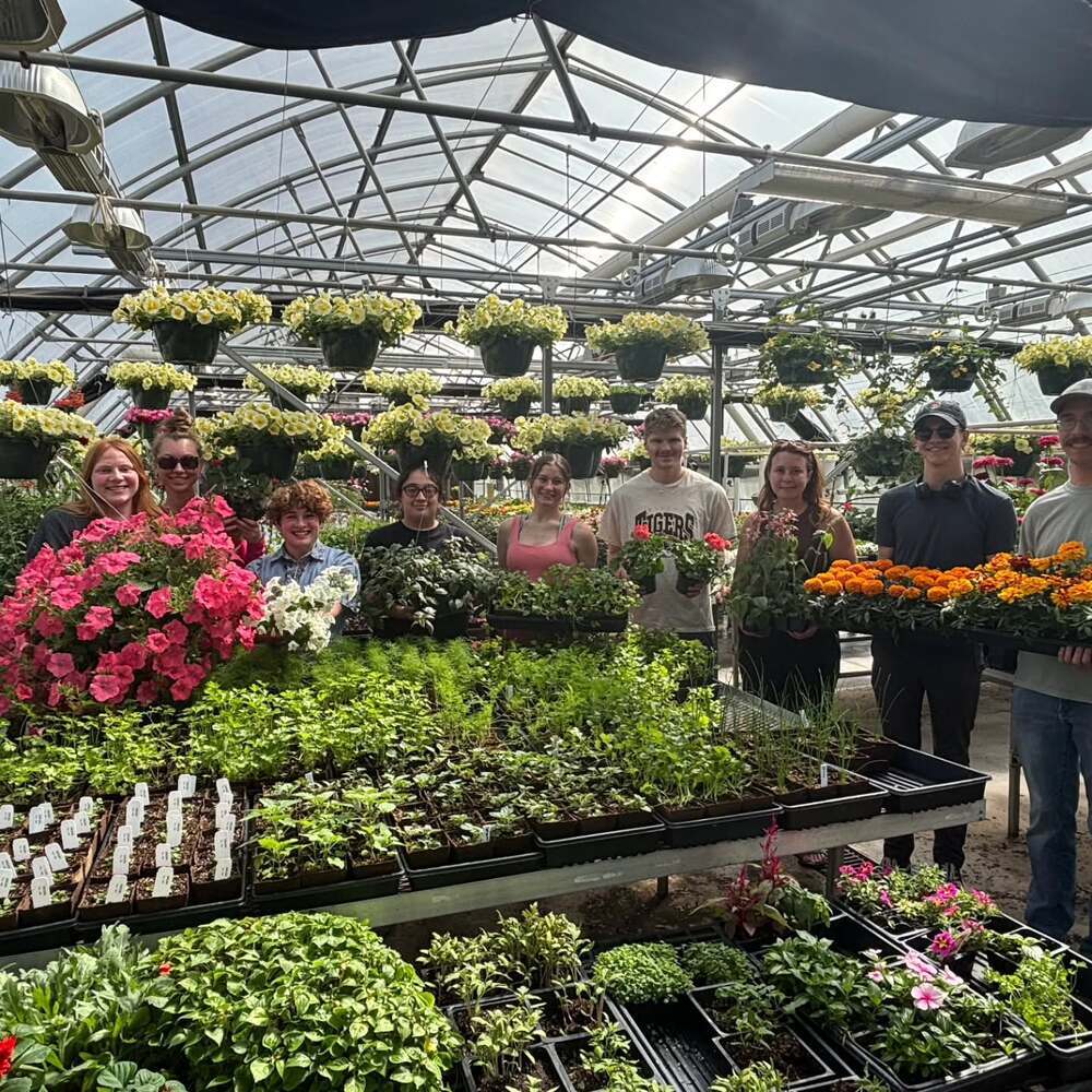 Family visiting green plant farm