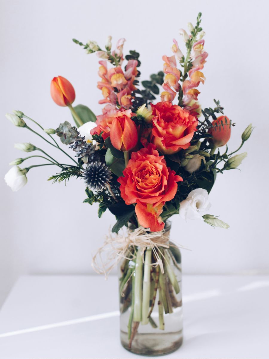 Clean transparent vase with flowers