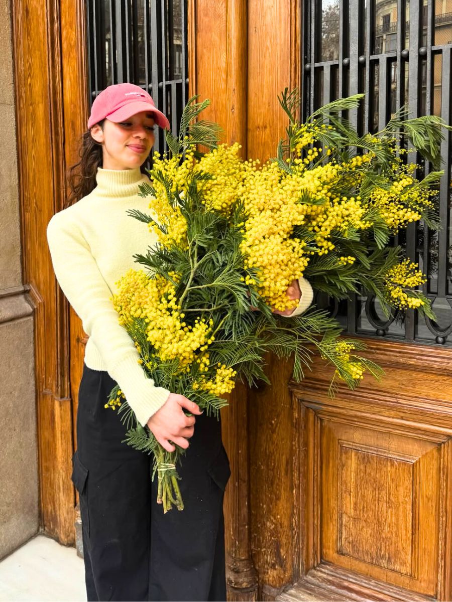Girl with mimosa flowers