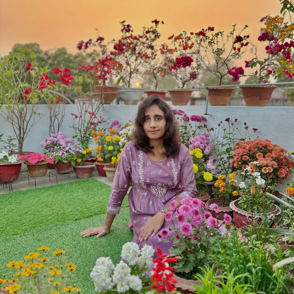 Girl seating at terrace garden