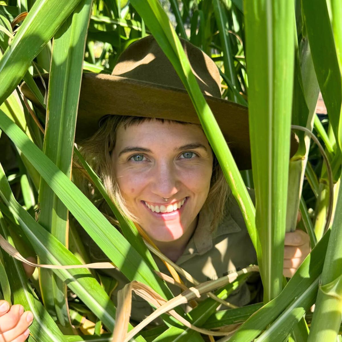 Girl in between plants