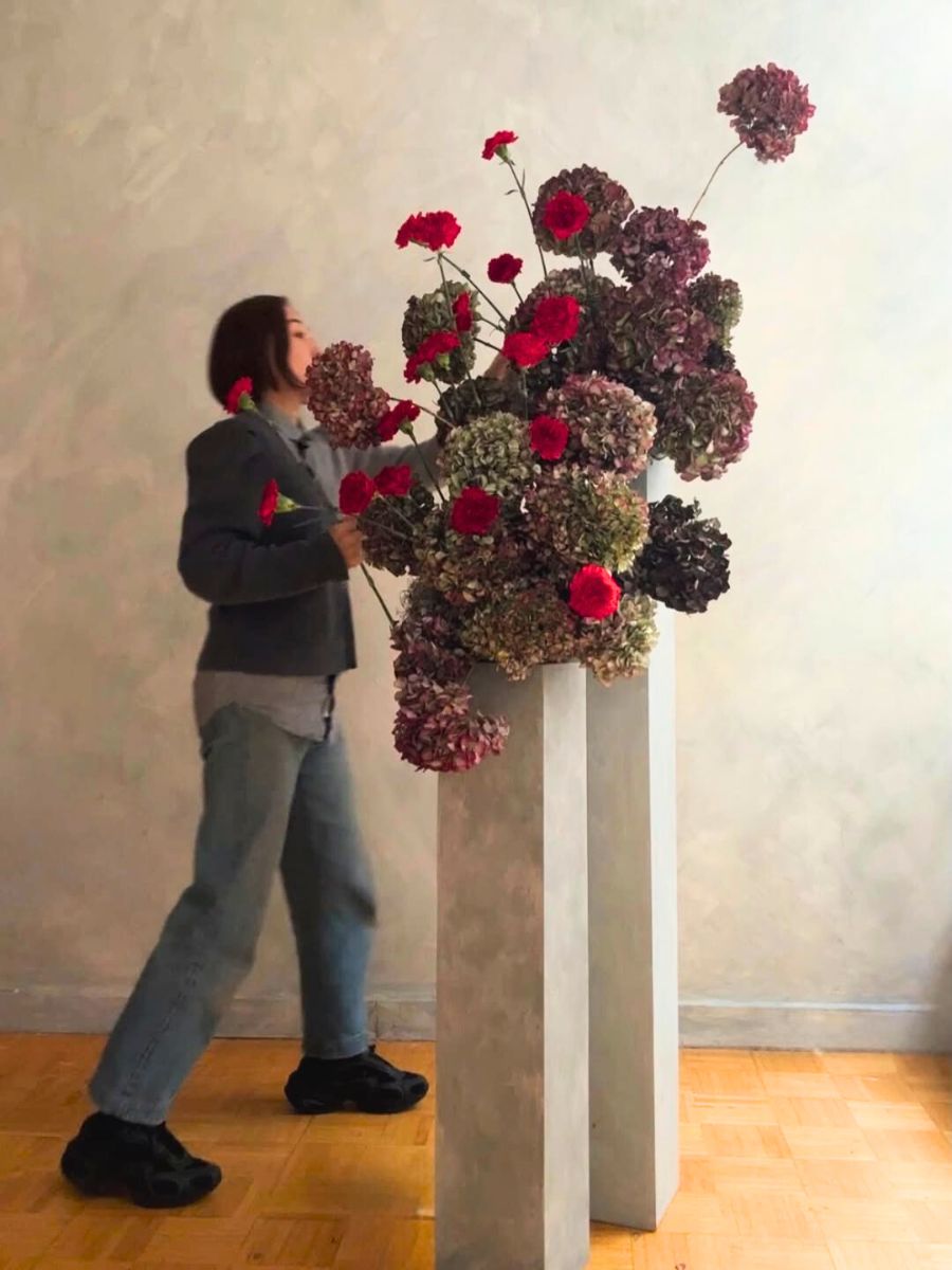 Eriko Nagata designing a floral arrangement with hydrangeas