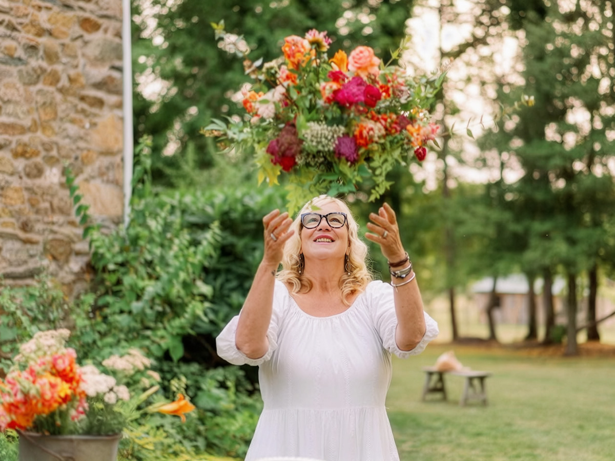 Holly Chapple throwing flowers in the air