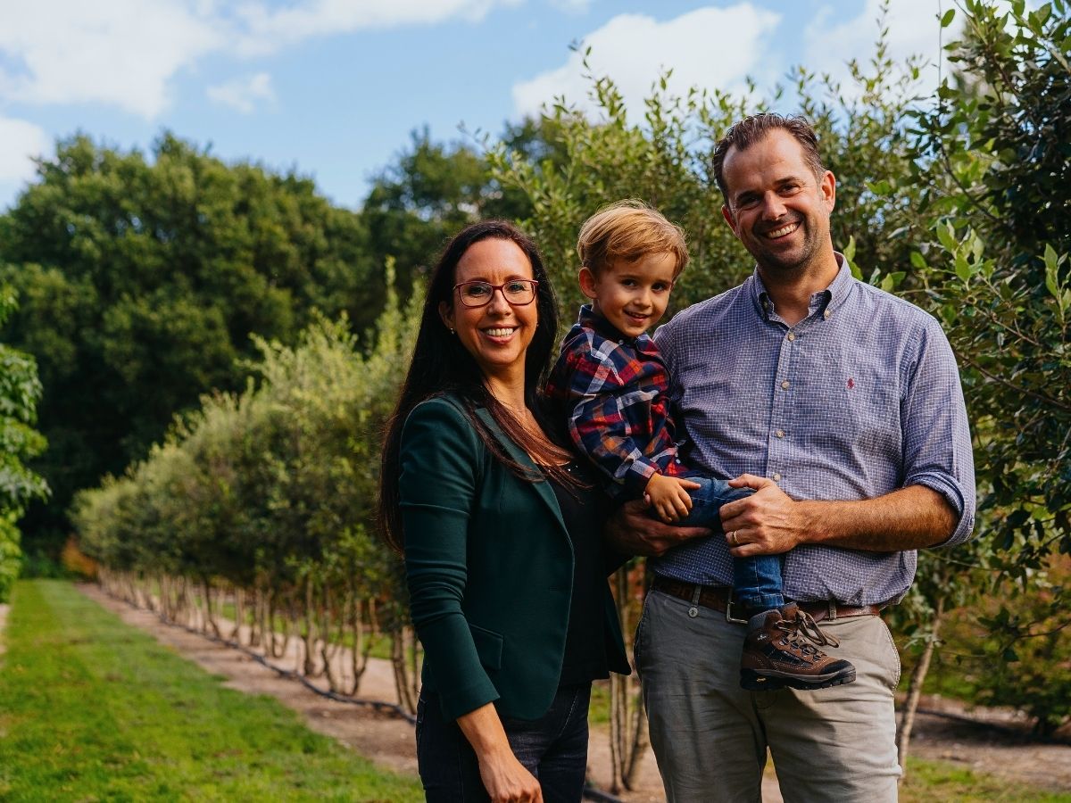 Marielle and Bart Mentens at the Tree Nursery With Their Son