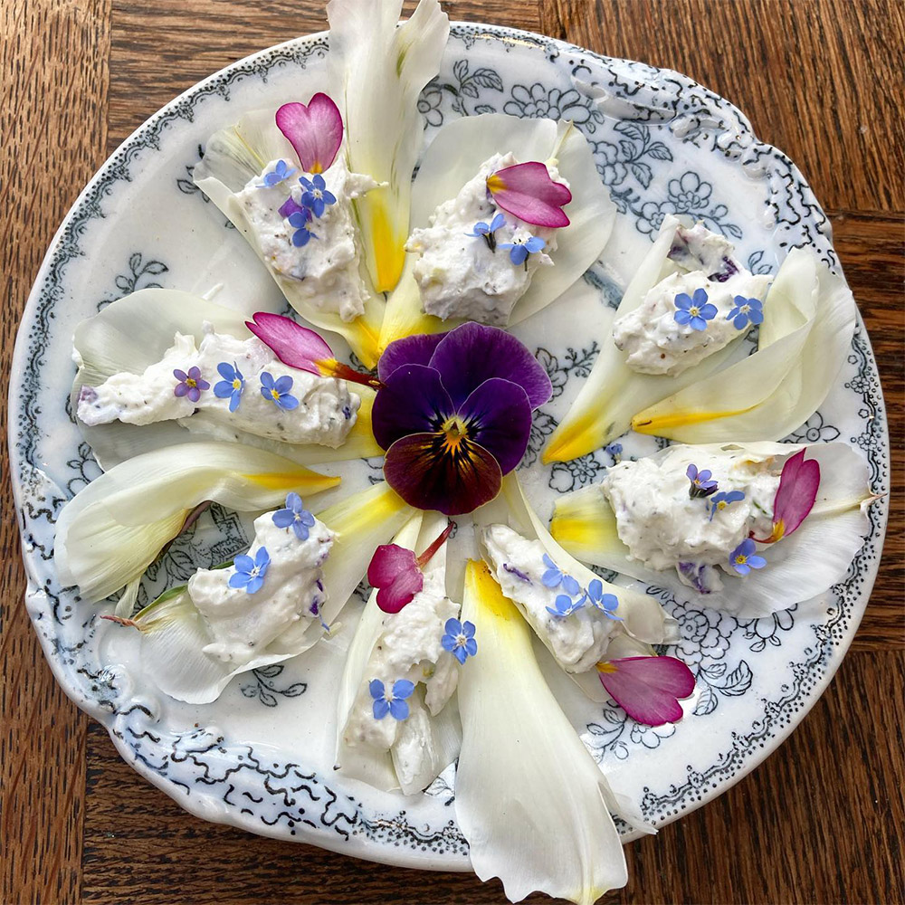 Goat cheese dish with edible flowers by katy_in_the_garden