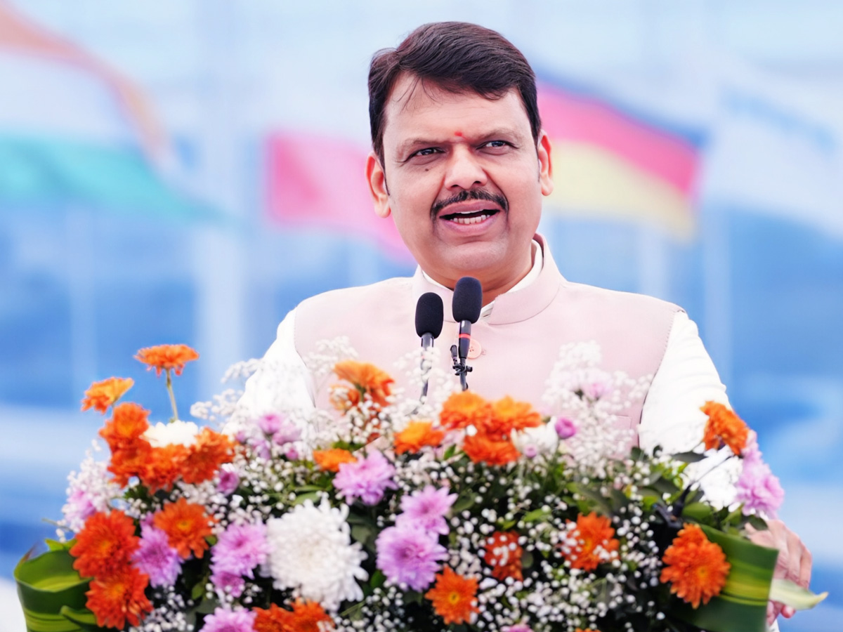 Devendra Fadnavis speaking behind bunch of flowers