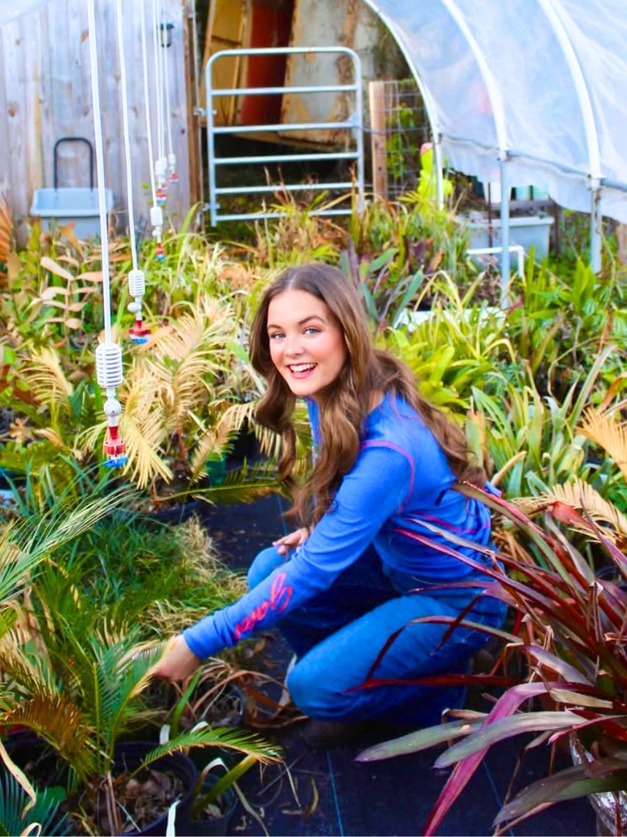 A happy girl in a colorful garden