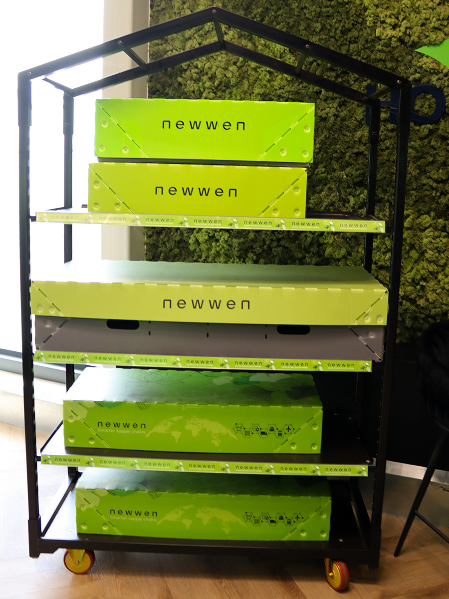 Newwen black shop display trolley with green boxes