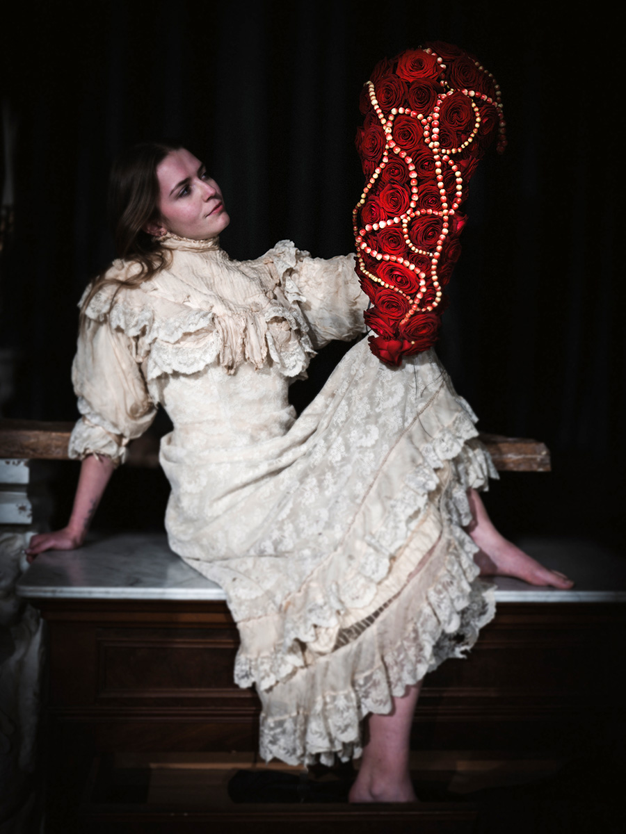 Gaetan Jacquet Girl looking at Red Naomi wedding bouquet