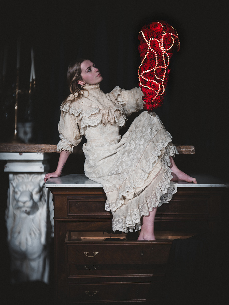 Gaetan Jacquet Girl on desk with Red Naomi wedding bouquet