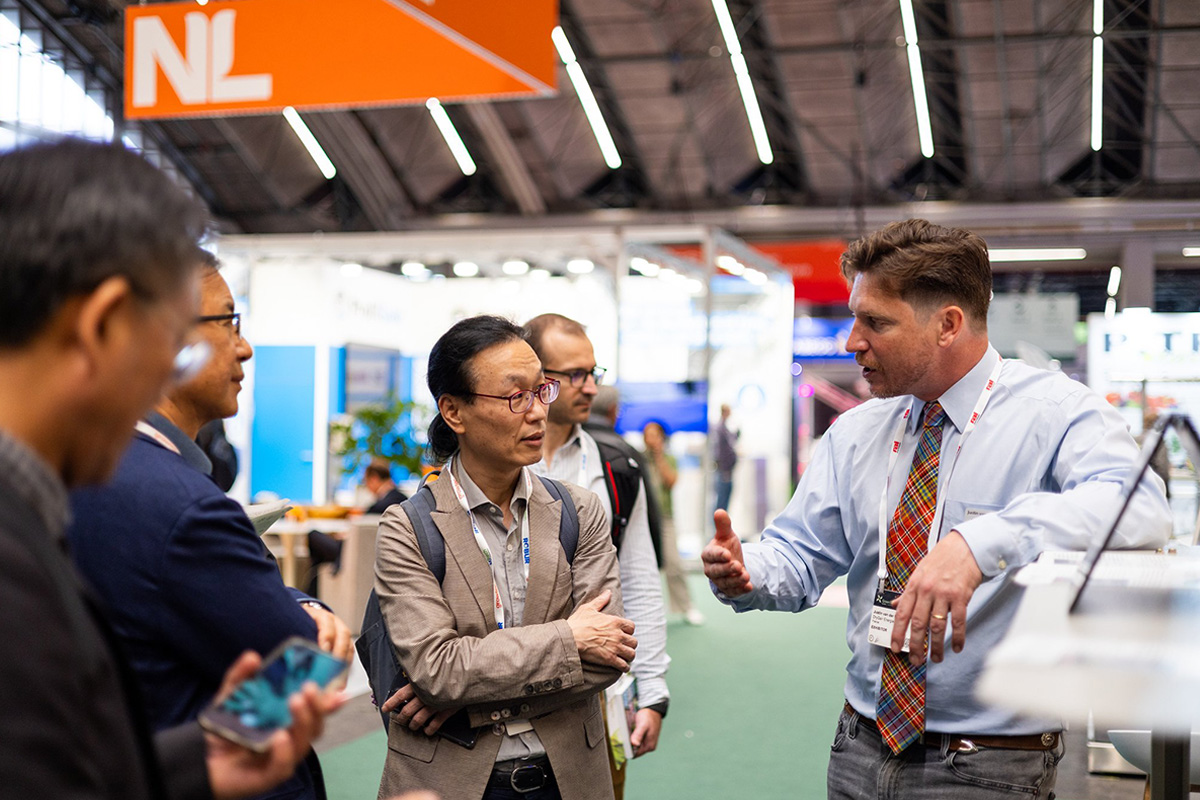 GreenTech 2025 Exhibitor explaining