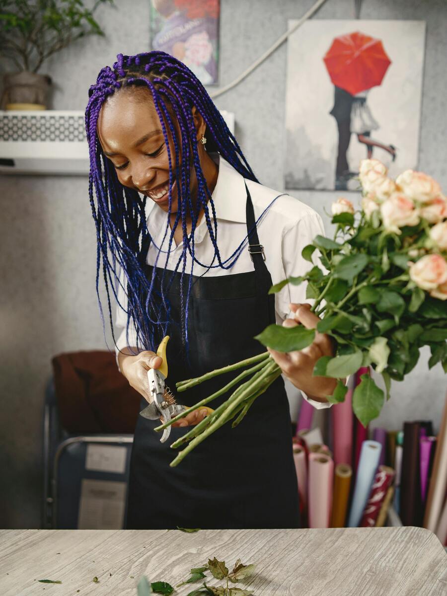 Women florist prepare flower bouquet