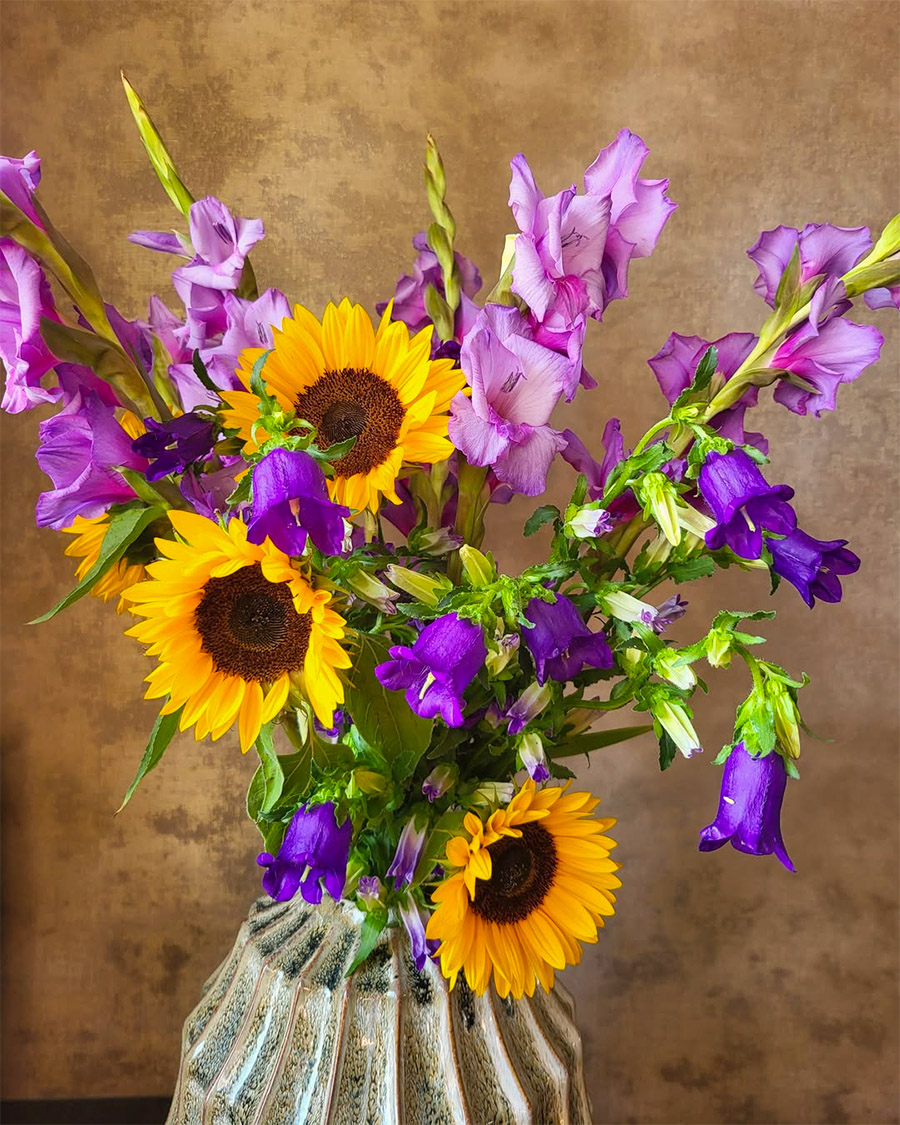 Campanula bouquets with sunflowers and gladioli