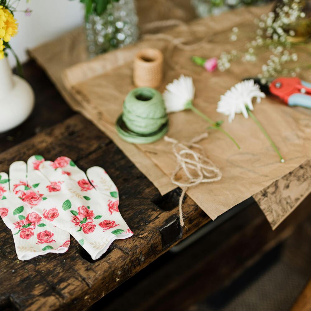 A floral design studio with a custom wood workbench during bouquet preparation