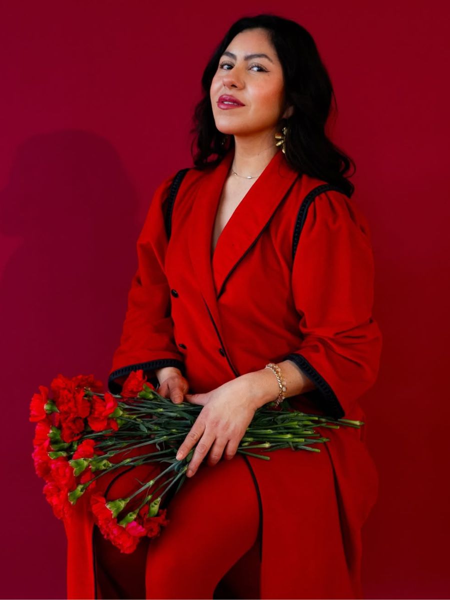 A girl with red carnations