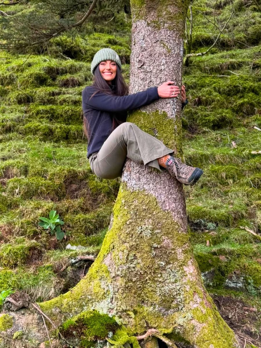 A girl hugging a tree