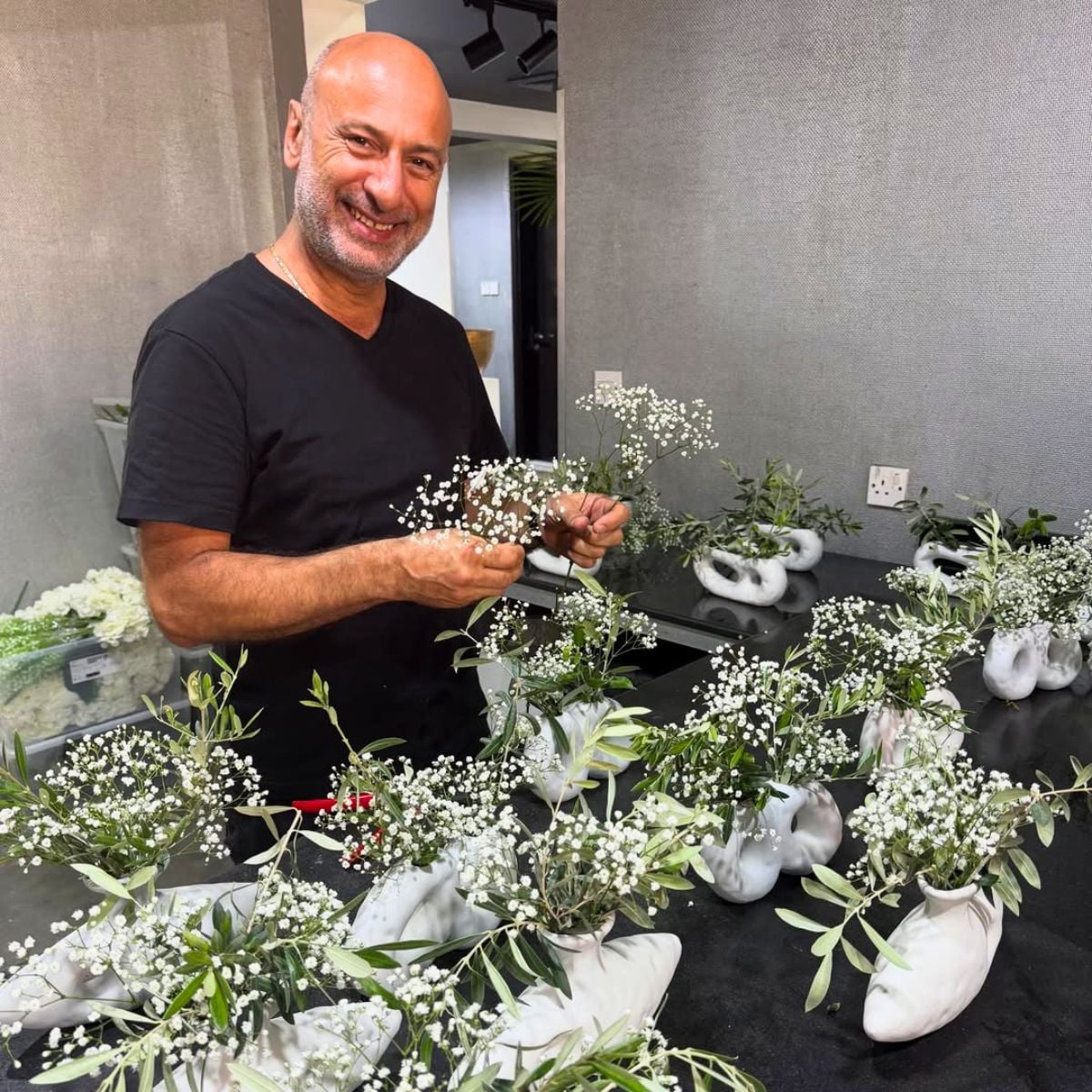 A guy making gypso arrangements