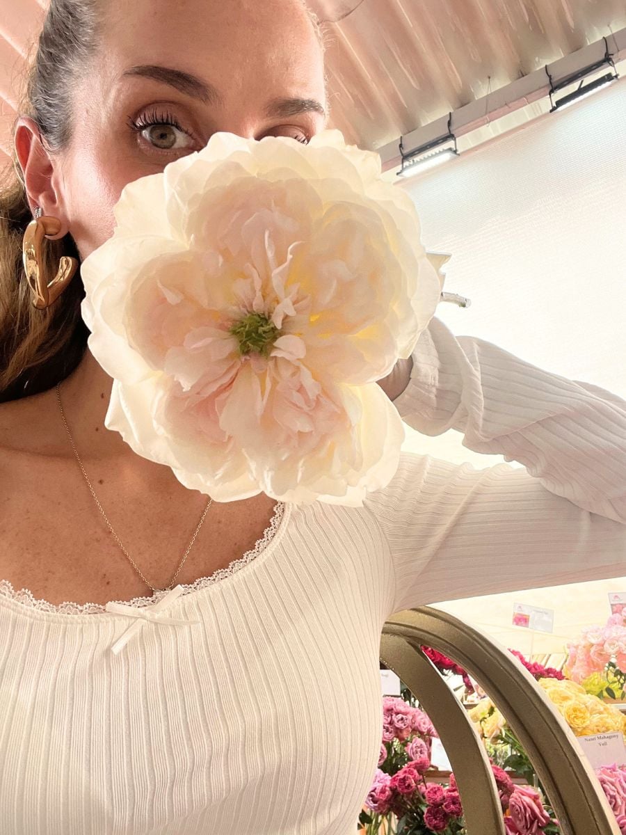 Melissa with a huge garden rose