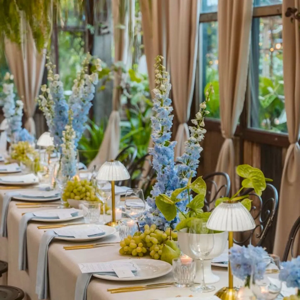 Delphiniums on wedding table by thegroundsfloralsbysilva
