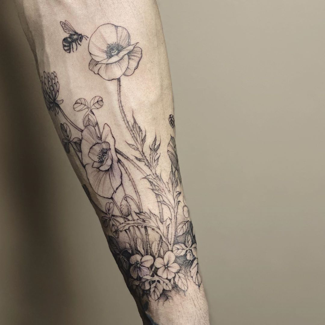 Black flower tattoo by Carin Silver
