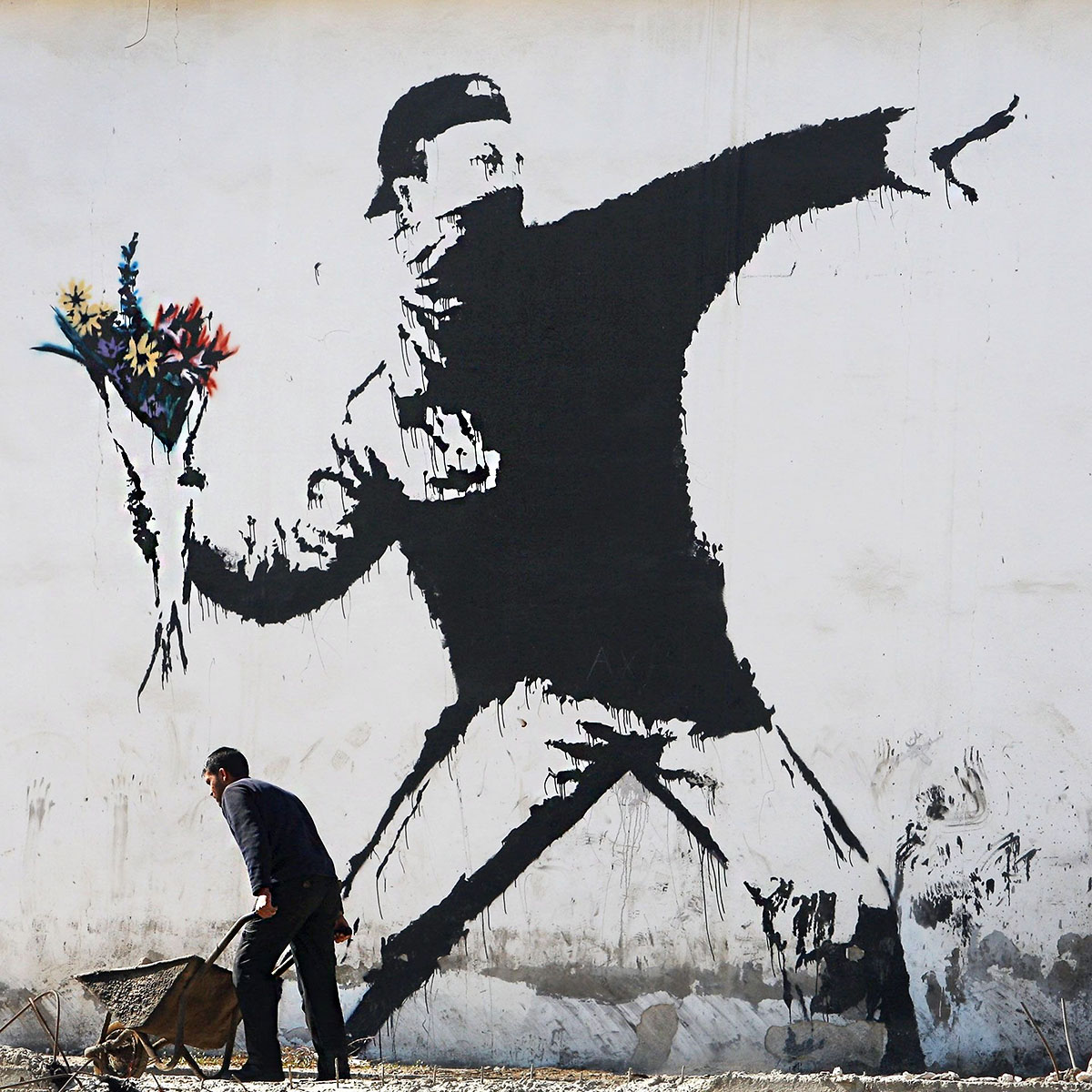 banksy-advocates-for-peace-with-rage-the-flower-thrower-featured