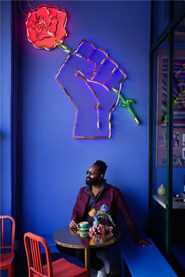 Florist and Artist Maurice Harris Believes in the Business of Beauty - Maurice with neon flower sign - on thursd