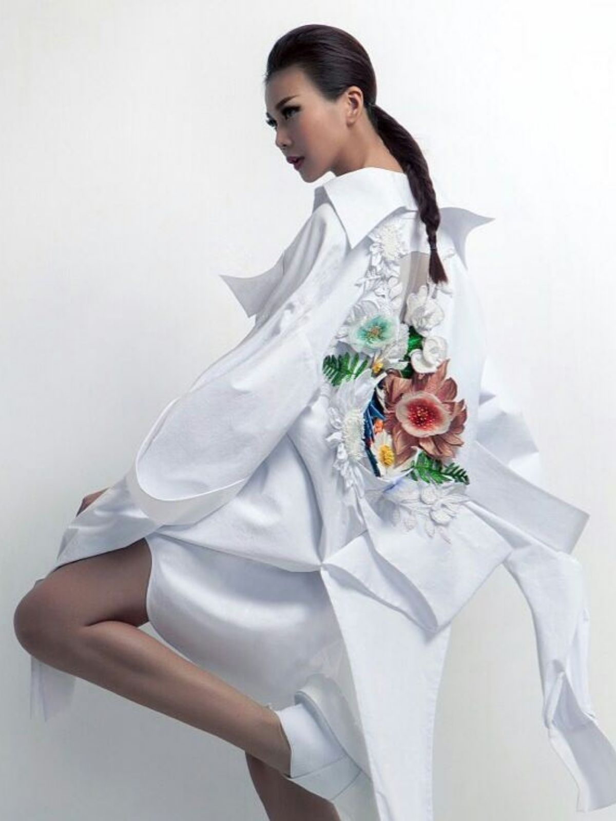 model with white blouse and embroided flowers - nguyen cong tri on thursd