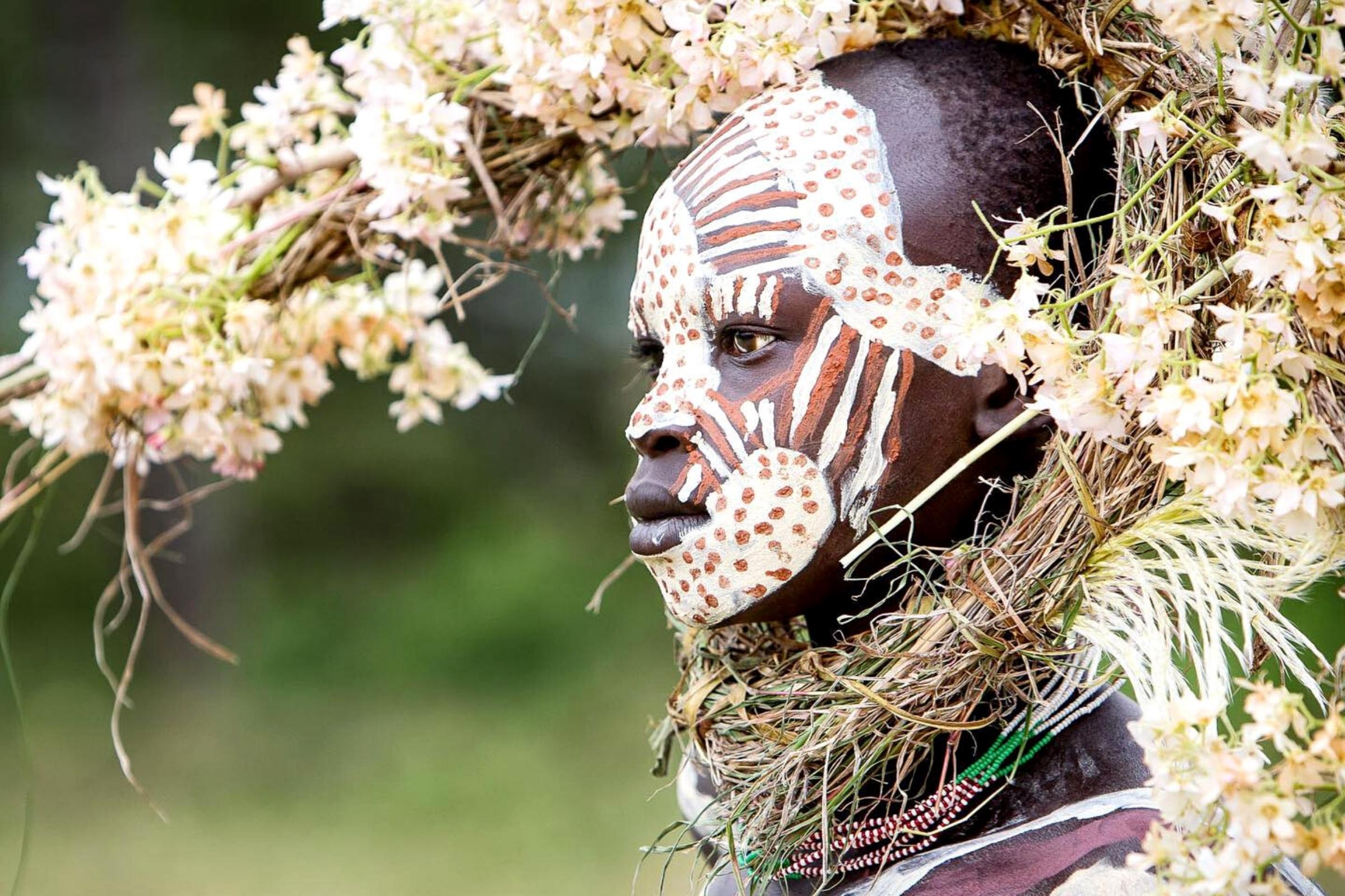 people-from-the-ethiopian-suri-tribe-wear-intricate-face-paint-and-don-breathtaking-floral-headpieces-featured
