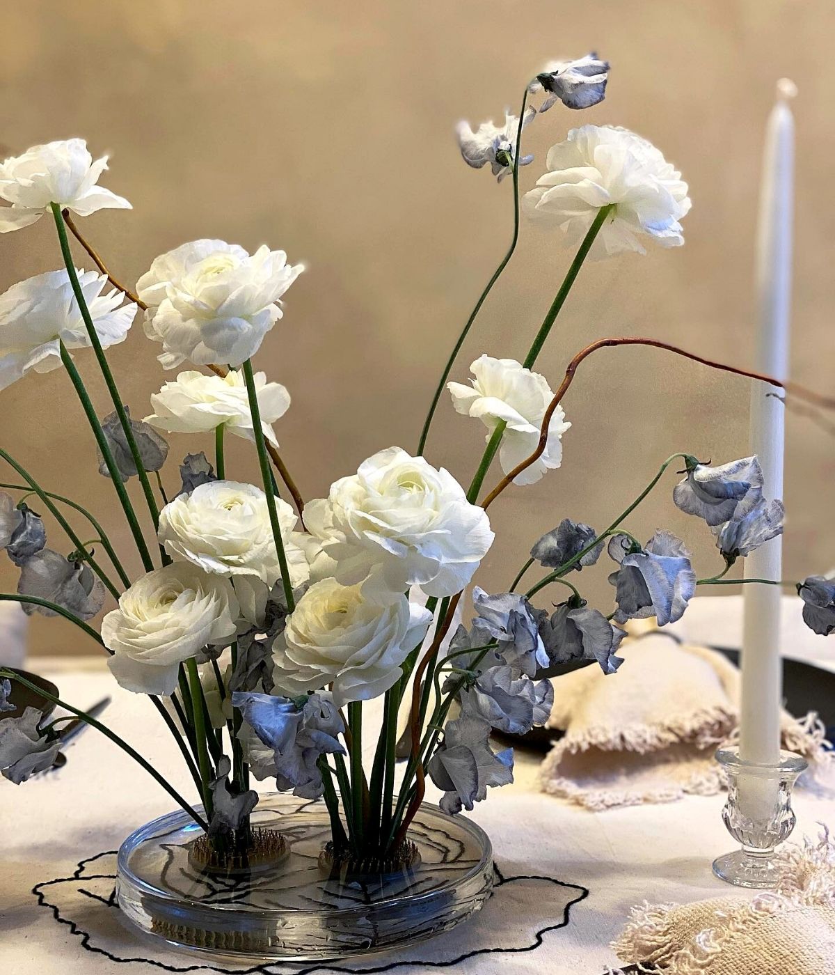 Table Setting With White Ranunculus in Ikebana Style by Rachel Clark