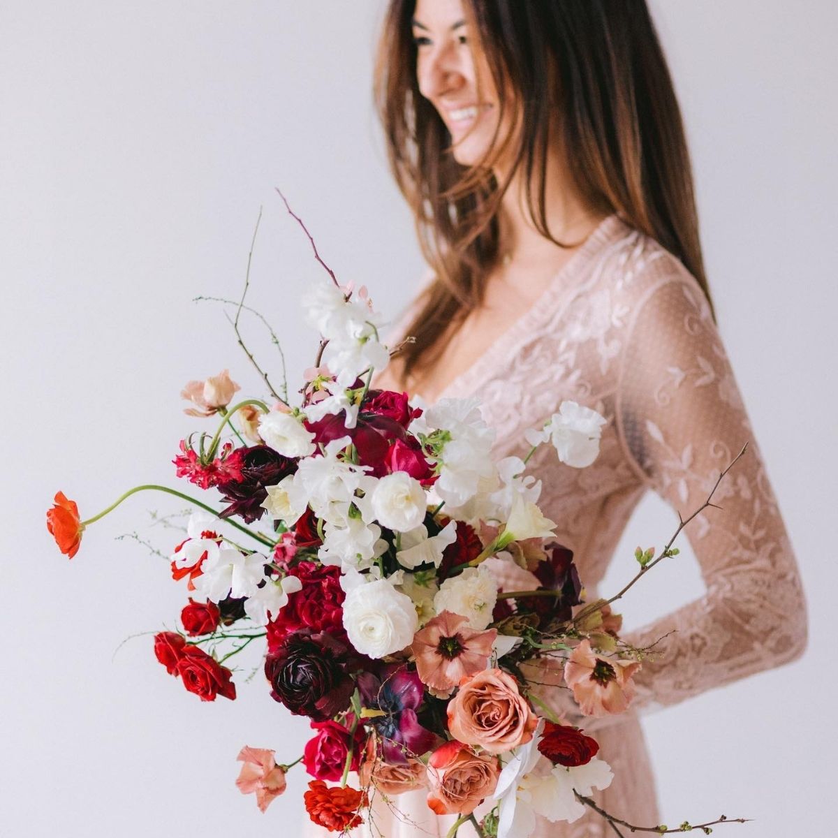 Paulina with a wedding bouquet in red, orange, creamy colors - on Thursd