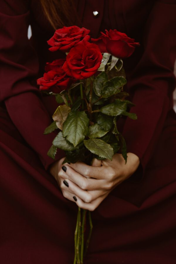 red roses held in hand - Different Colors of Roses and Their Meaning Red Roses